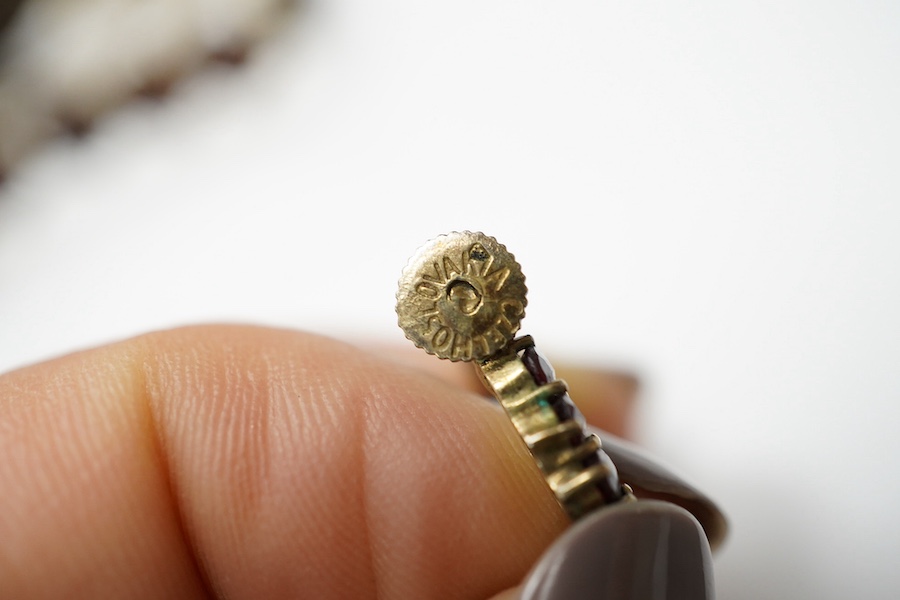 Three items of gilt white metal and garnet paste cluster set jewellery, comprising a bracelet, bangle and pair of Czechoslovakian earrings. Condition - fair